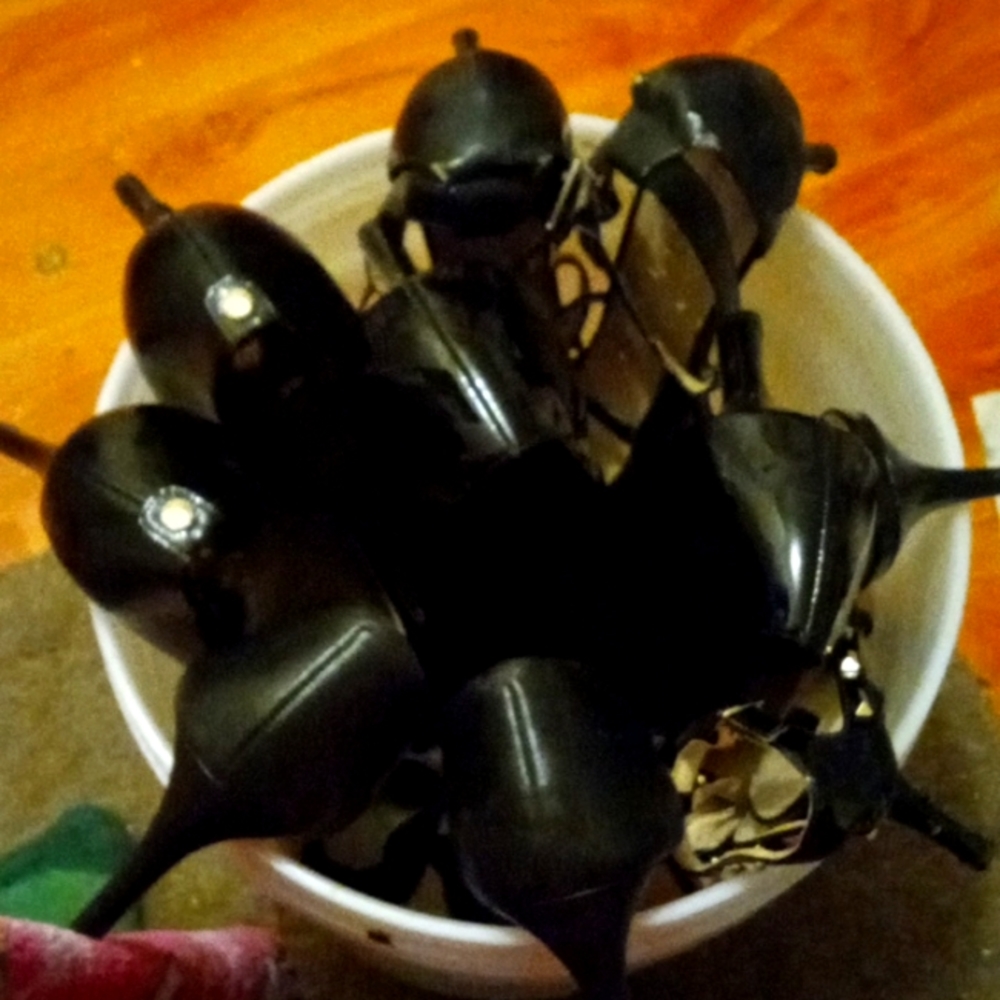 An whole bunch of black high heels